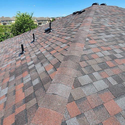 A close up of a roof with shingles on it.