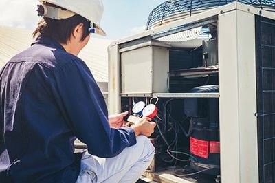 Maintenance Contracts — Man Checking Temperature of Air Condition in San Dimas, CA
