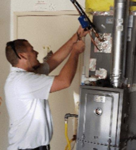 Heating Contractor — Contractor Installing Heater at House in San Dimas, CA