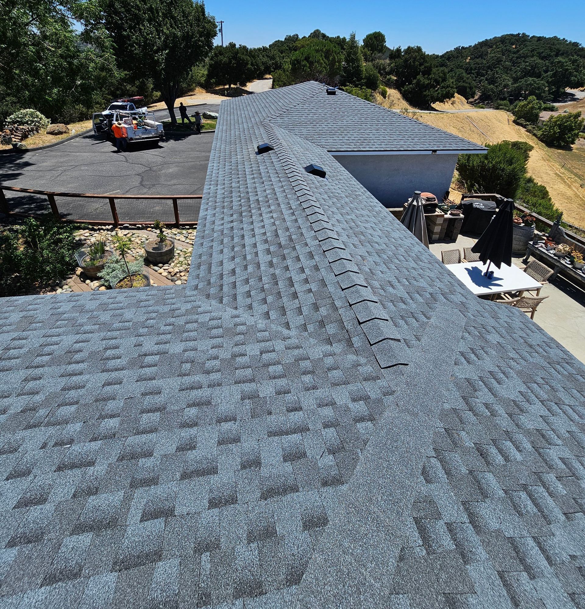 A house with a roof that has a lot of shingles on it.