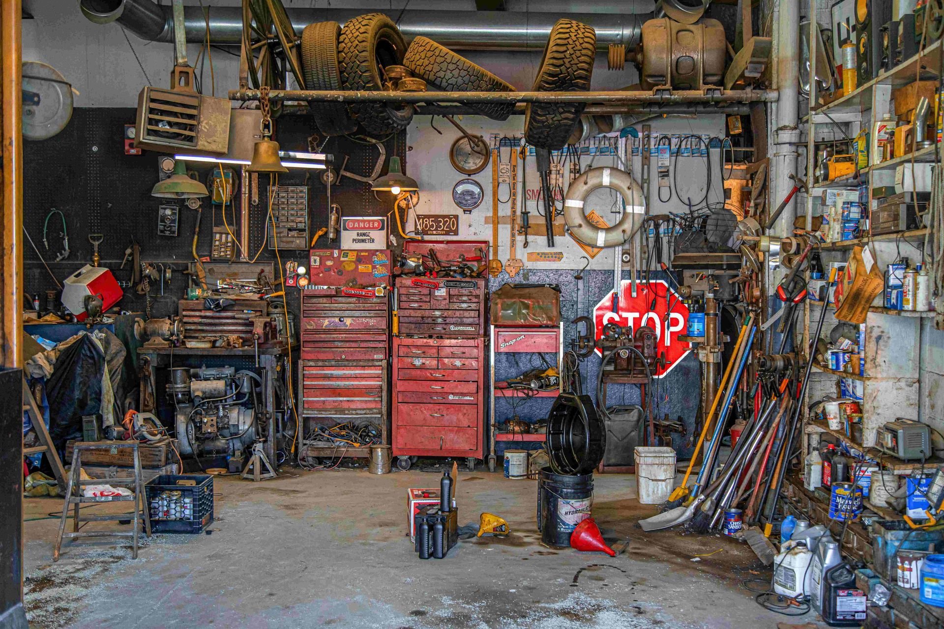a garage filled with tools and a stop sign