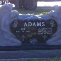 A black granite double gravestone with 