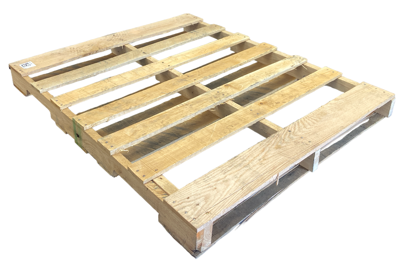 a wooden pallet is sitting on a white surface . One of the #2 pallets for sale