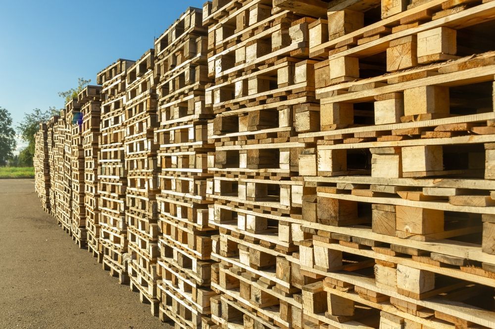 a row of wooden block pallets stacked on top of each other.