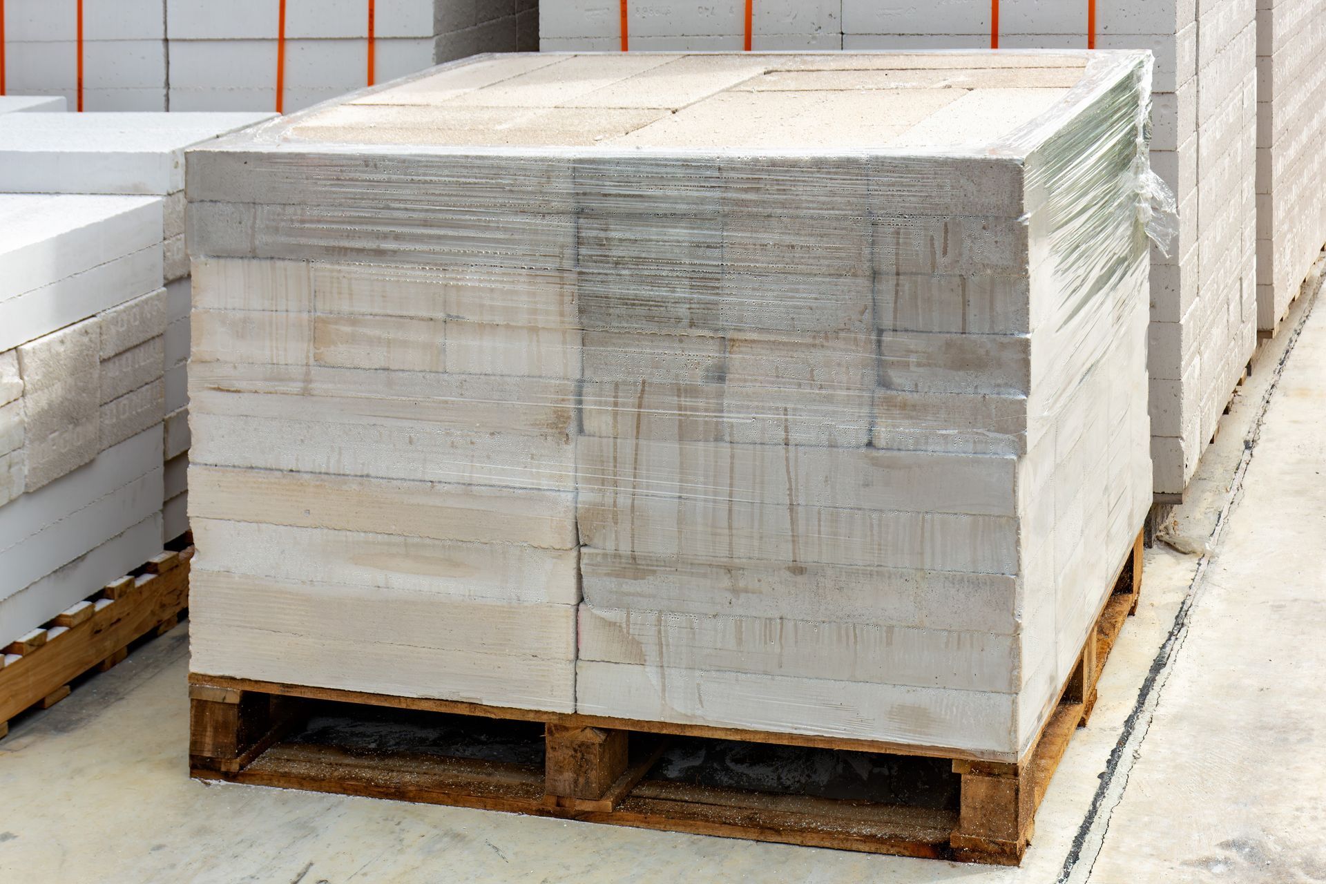 Lightweight concrete stacked on wood pallet to show correct pallet sizing and weight load. 