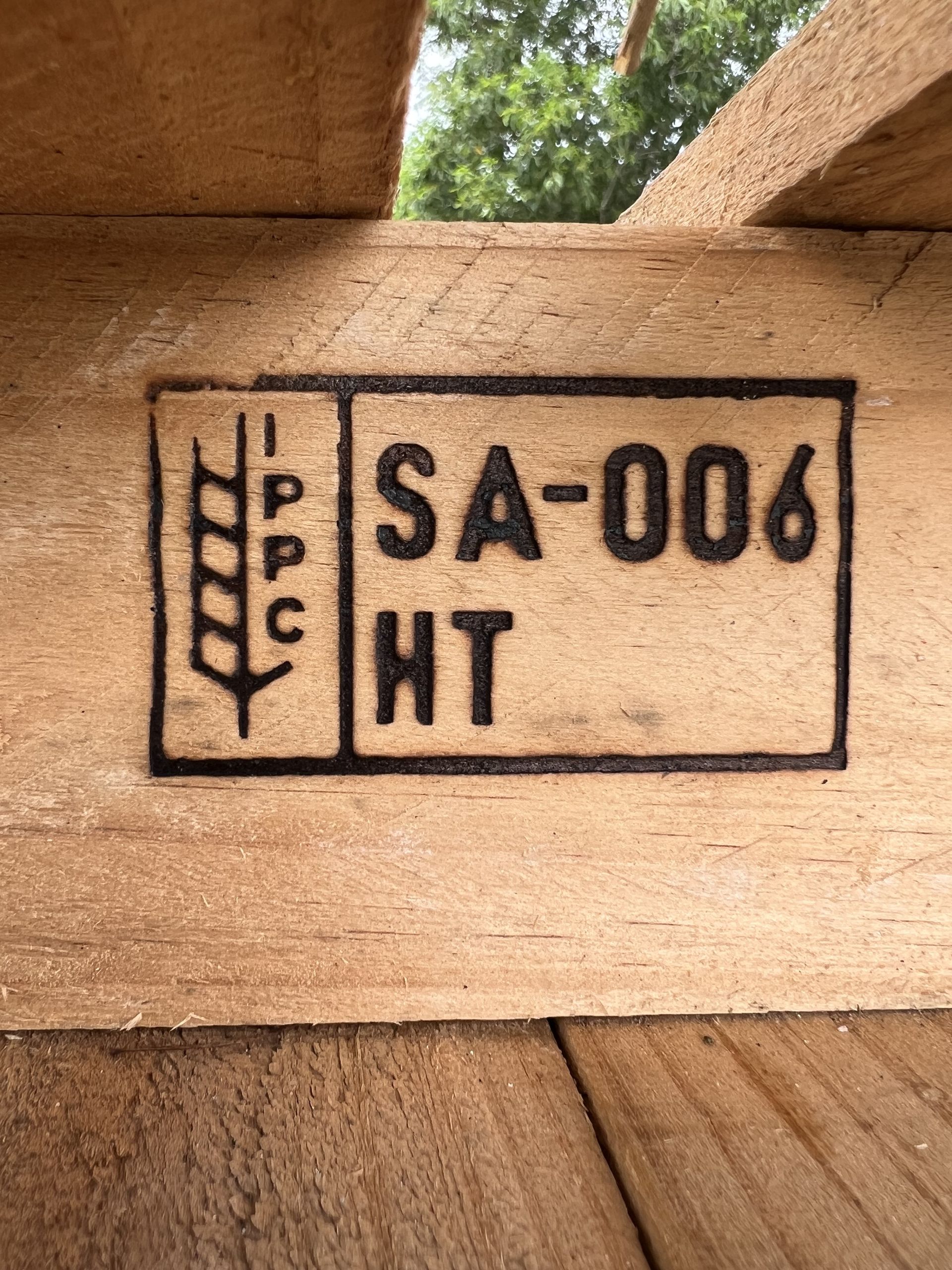 a wooden pallet burned with the ISPM 15 mark