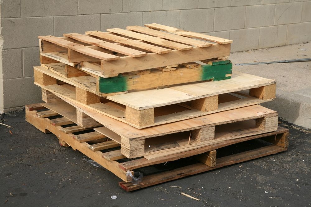 Three wooden pallets are stacked on top of each other