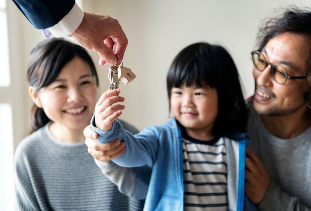 Cute Child Getting Home Keys — Fayetteville, NC — Market Value Realty & Appraisal Inc