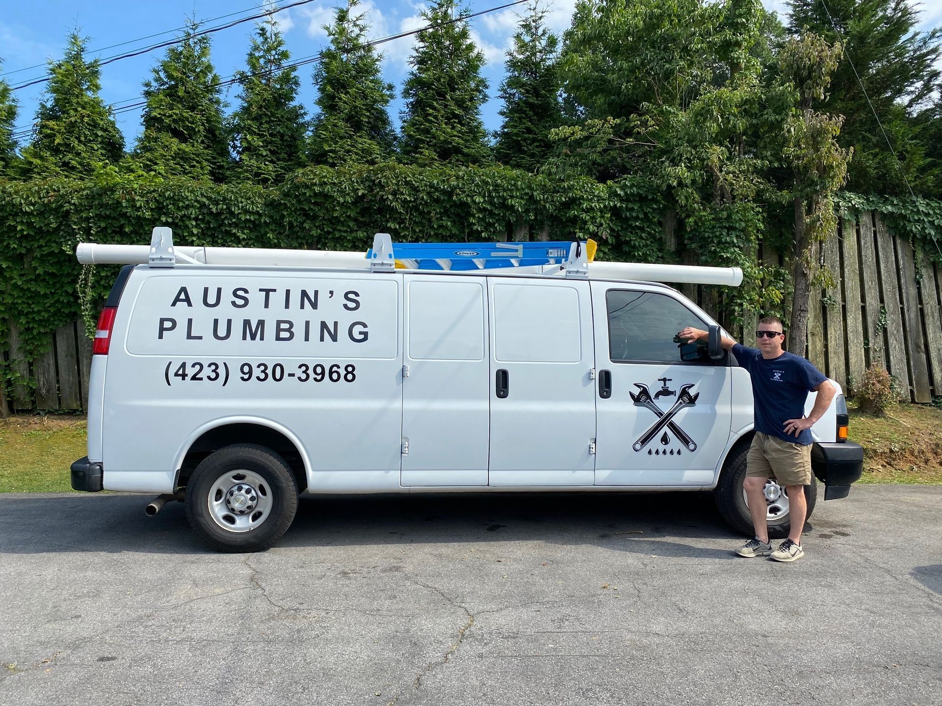 A Man Standing Next to A White Van that Says Austin 's Plumbing | Bristol, TN | Austin’s Plumbing, LLC