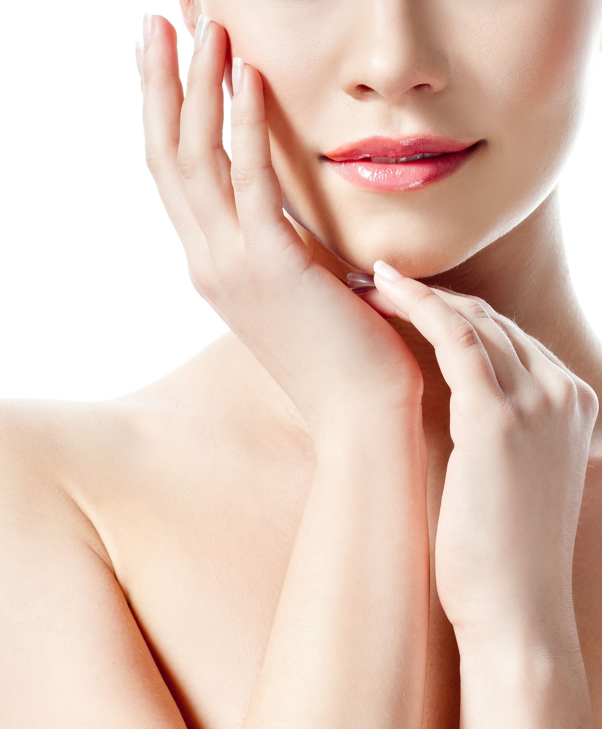 A close up of a woman 's face with her hands on it.