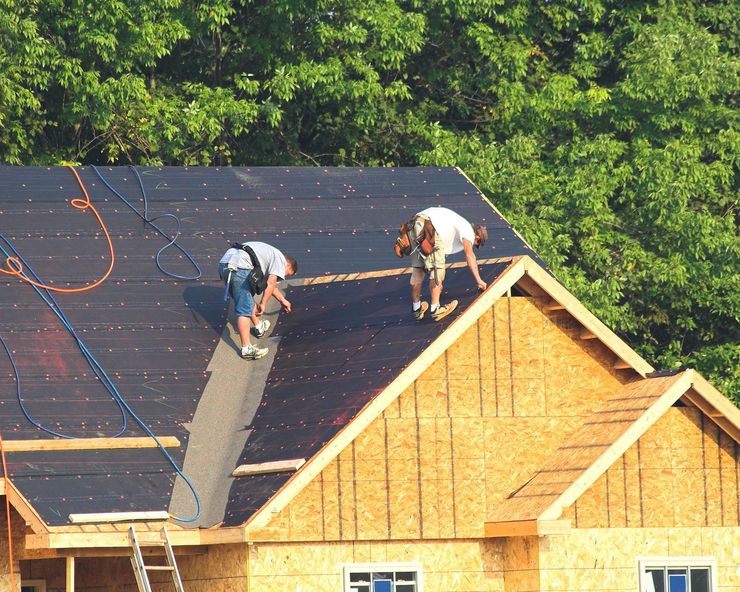Donnie Moore Construction installing shingles on a roof