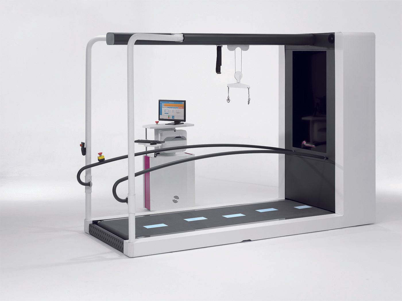 A treadmill with a computer on top of it