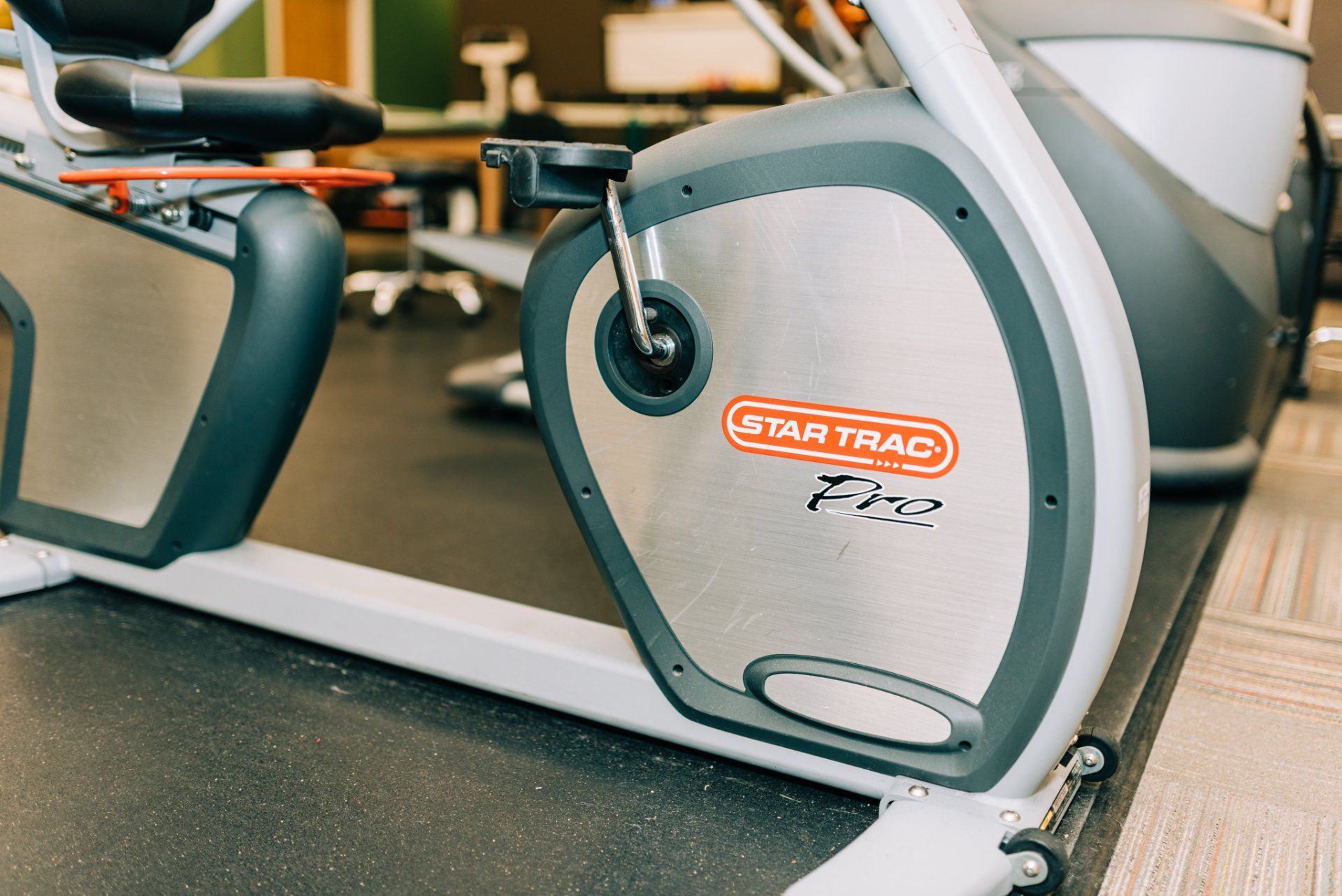 A close up of a star trac exercise bike in a gym