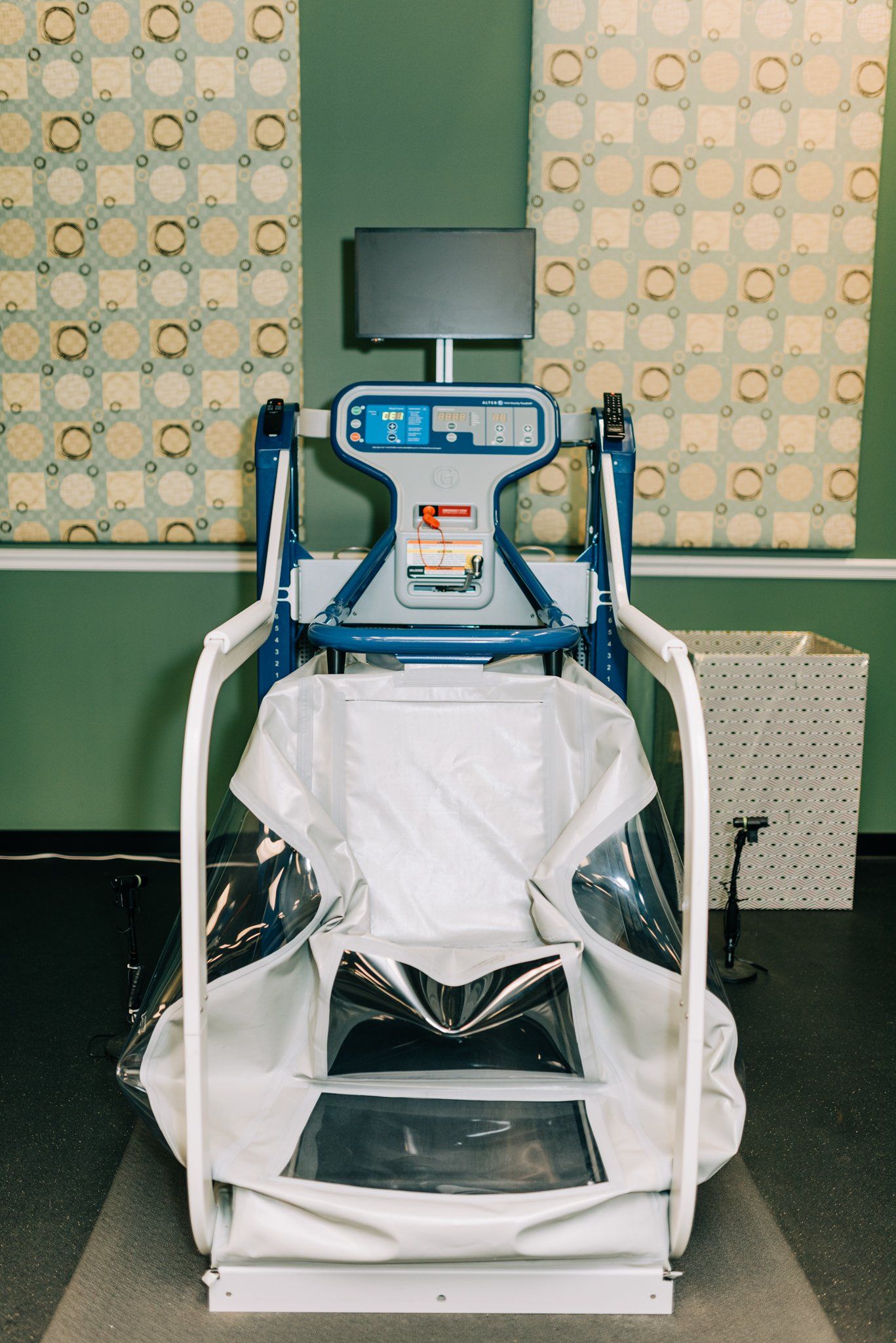 A chair with a monitor on top of it in a room.