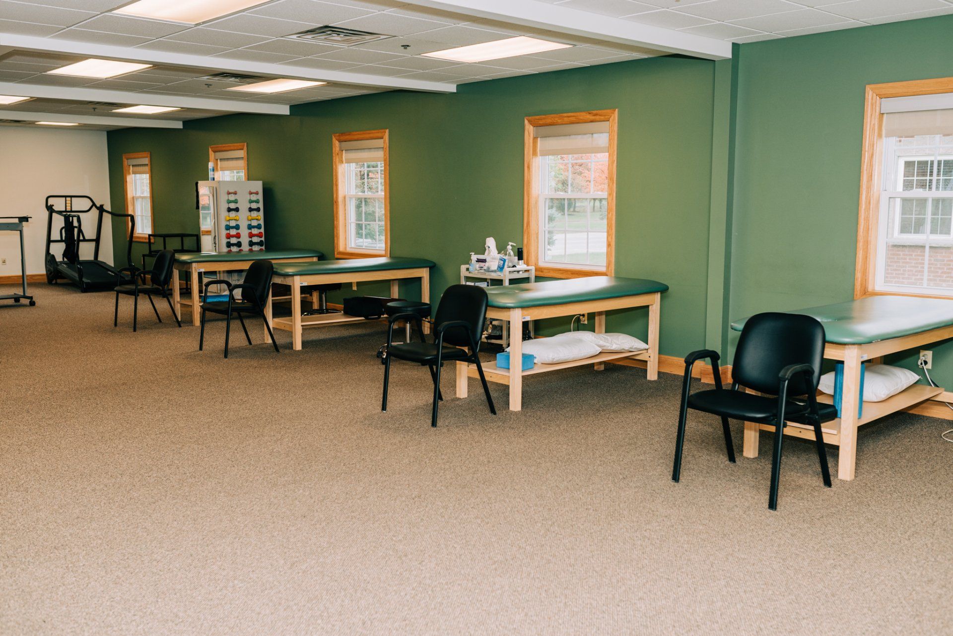 A large room with tables and chairs in it.