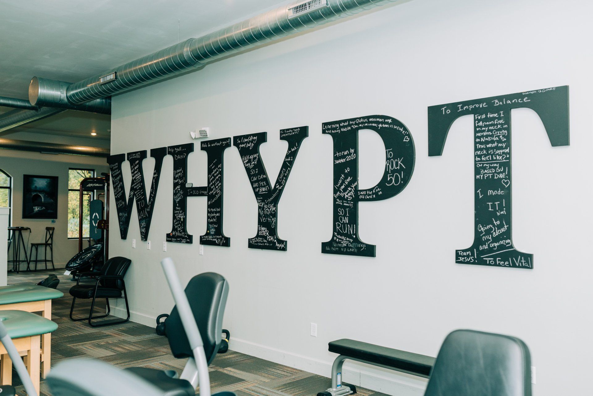 A gym with the word whypt painted on the wall.