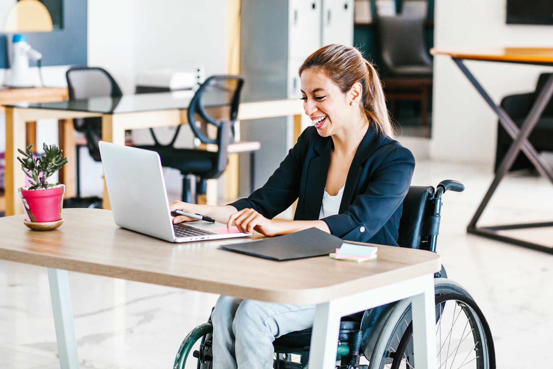 woman at desk in wheelchair