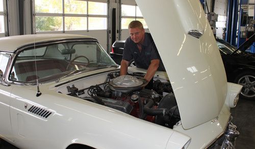 Man performing transmission repair in Lincoln, NE