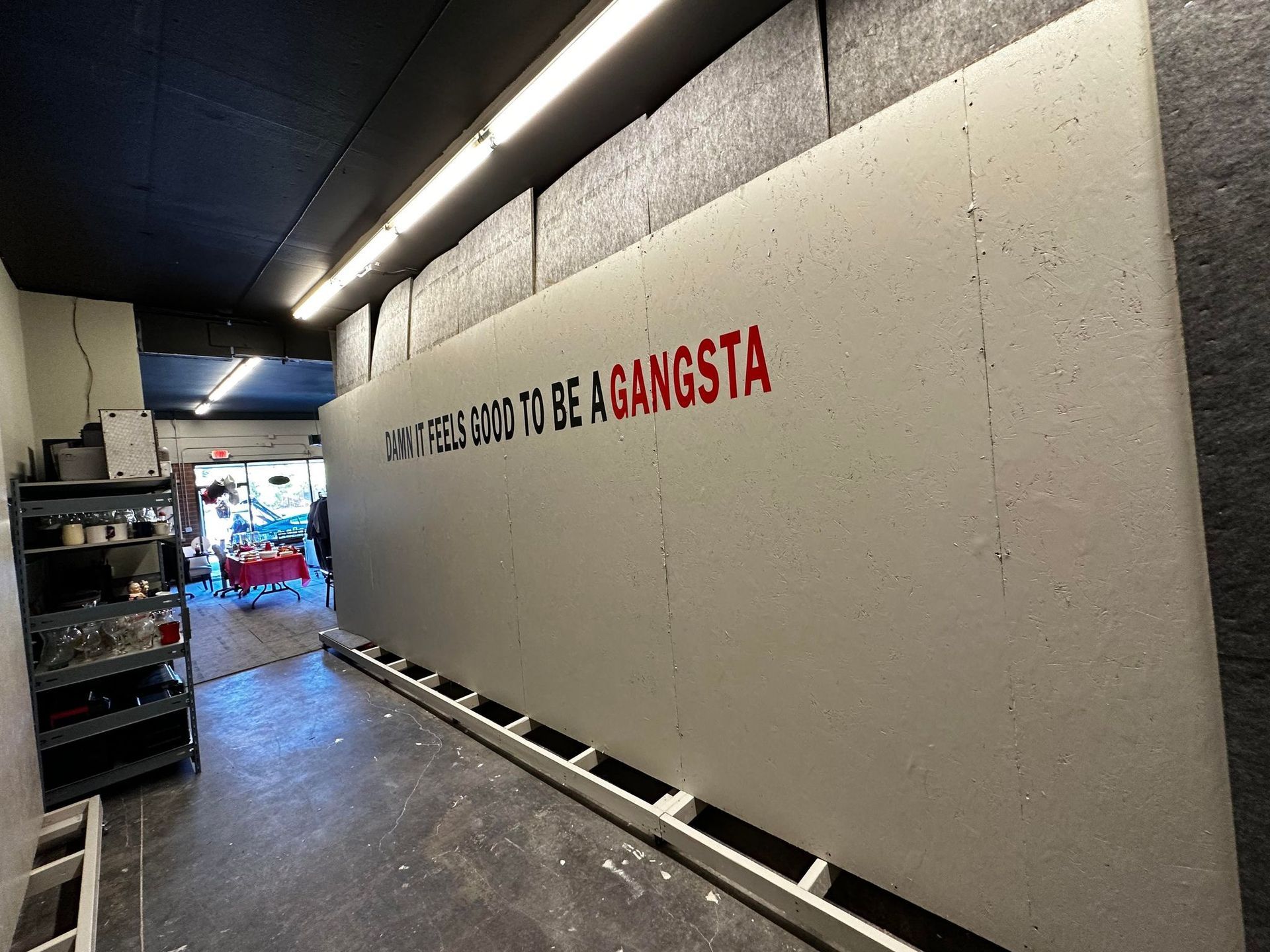 A wall with a quote on it that says to be against a gangsta