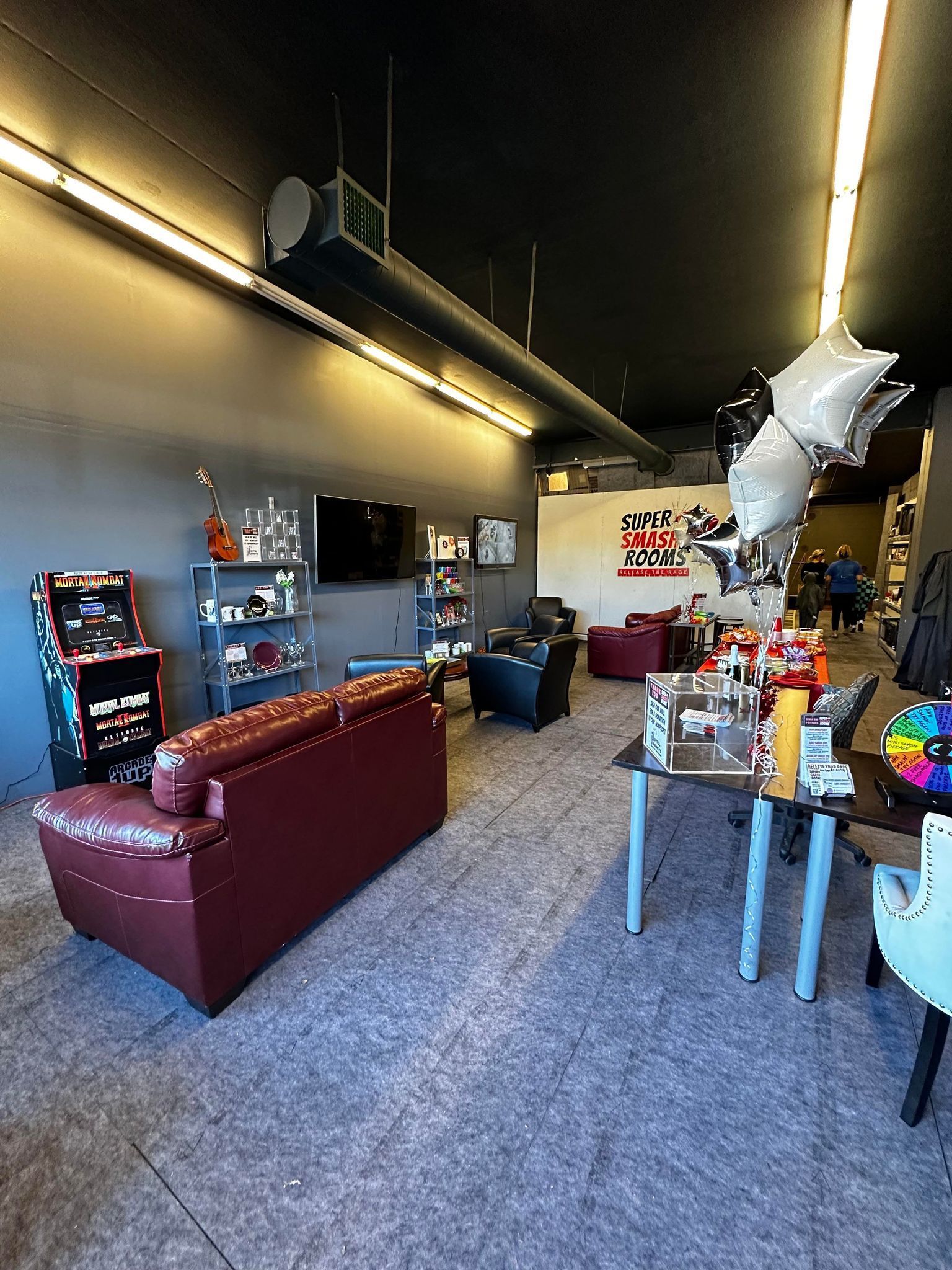 A living room filled with furniture and balloons.