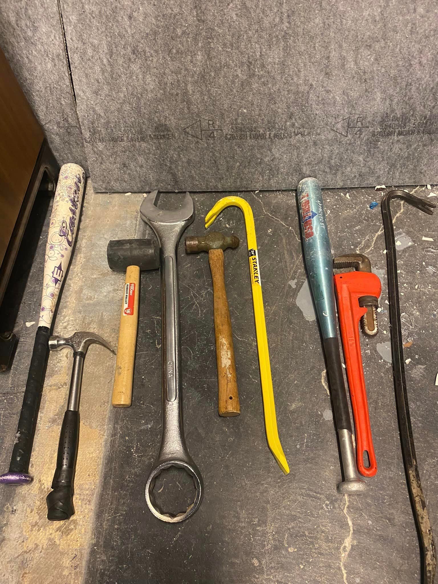 A bunch of tools are sitting on a table.