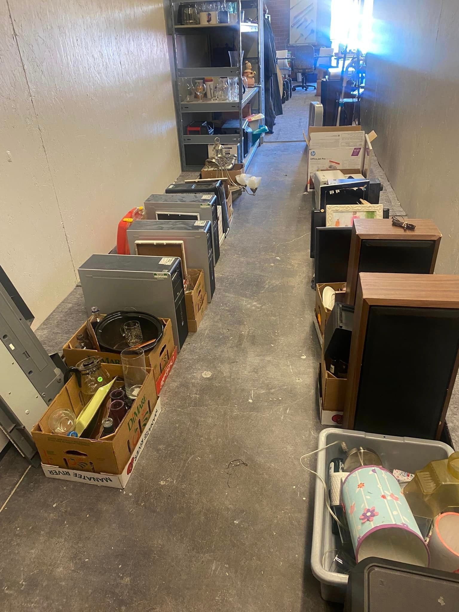 A room filled with lots of boxes and shelves.