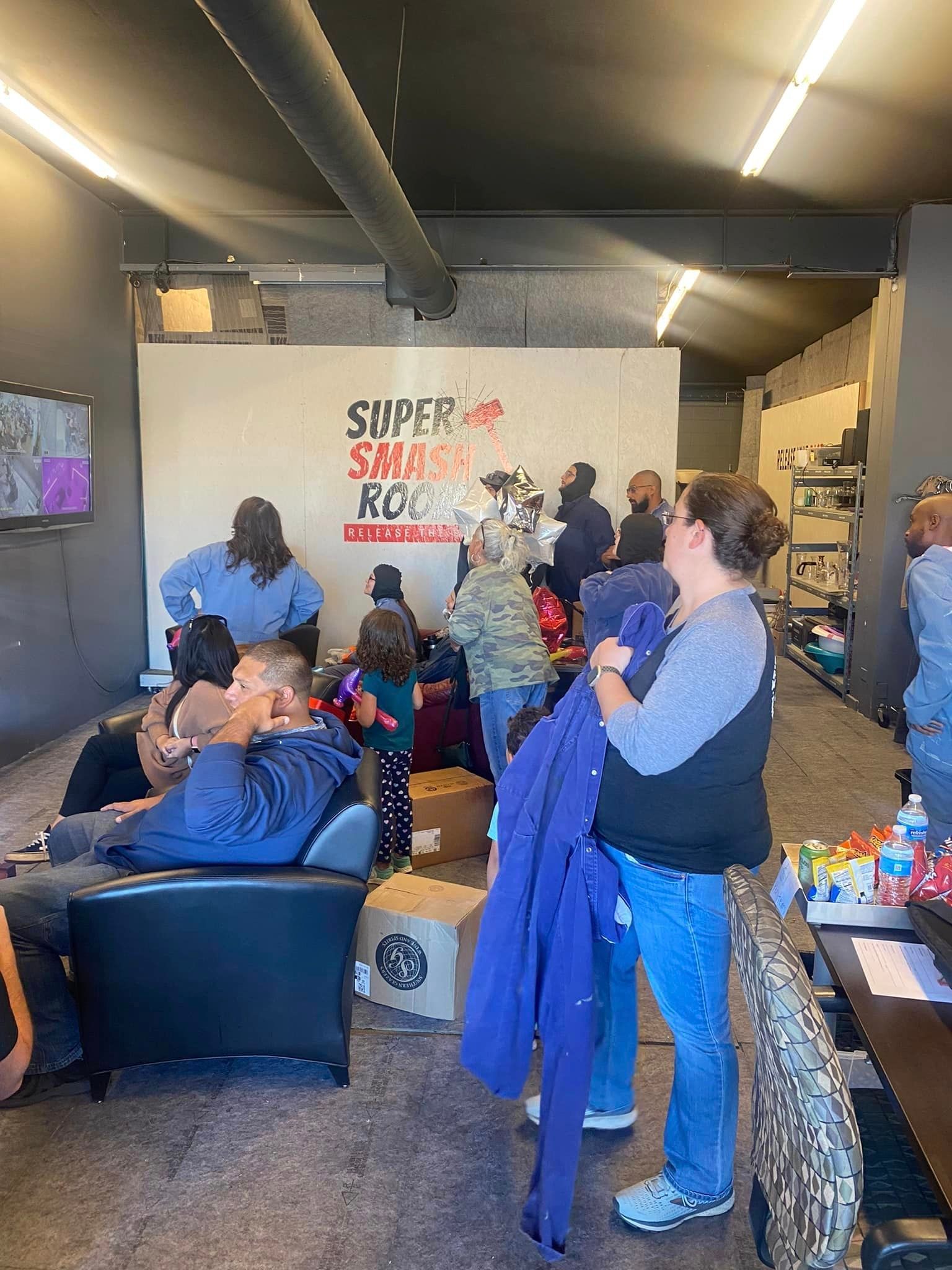 A group of people are gathered in a room.