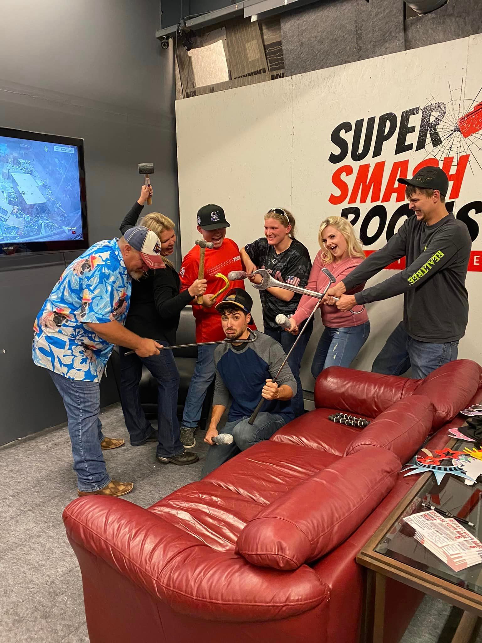A group of people are playing a video game in a living room.