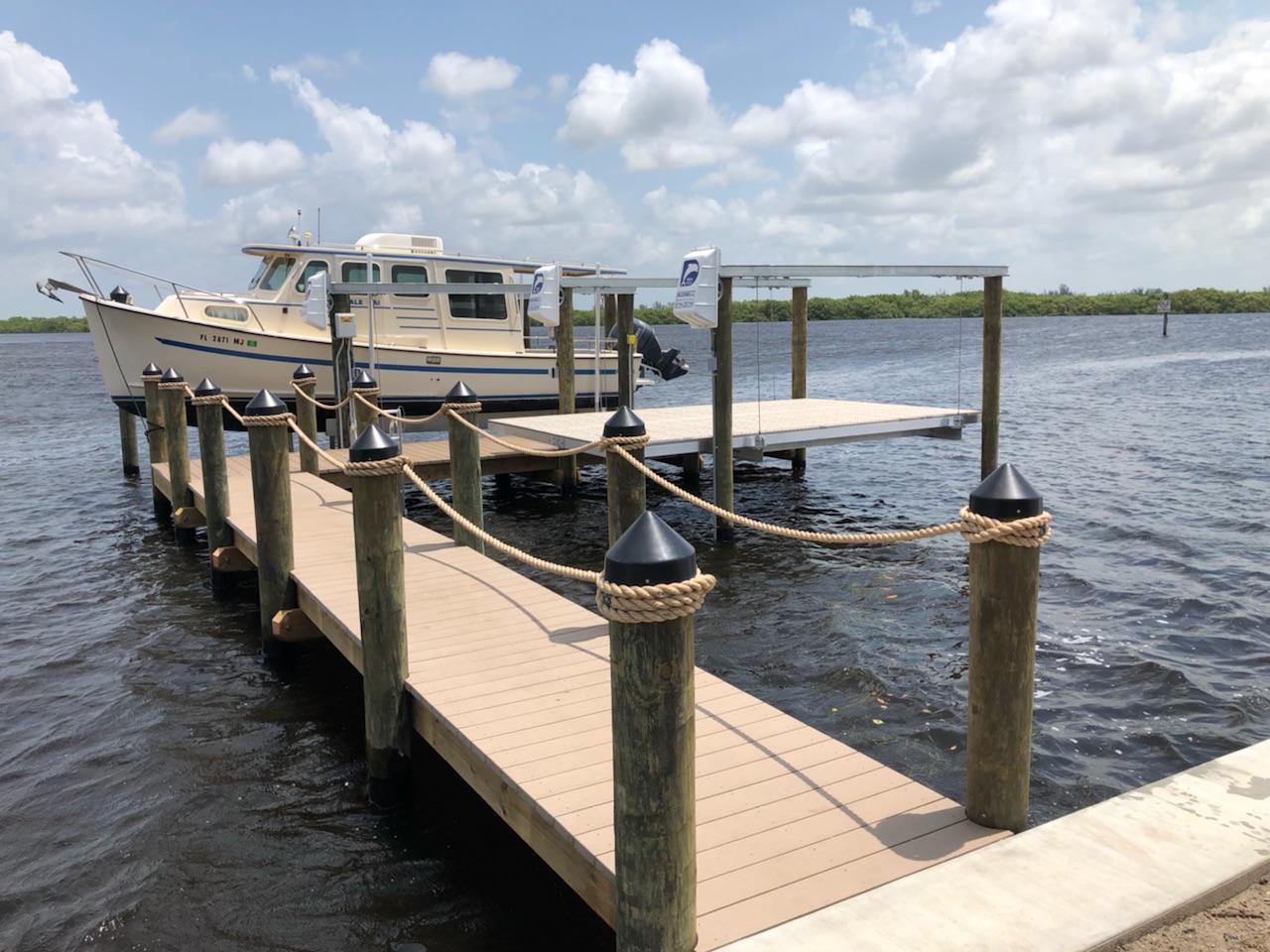 Boat and Dock — Docked Boat in Cape Coral, FL