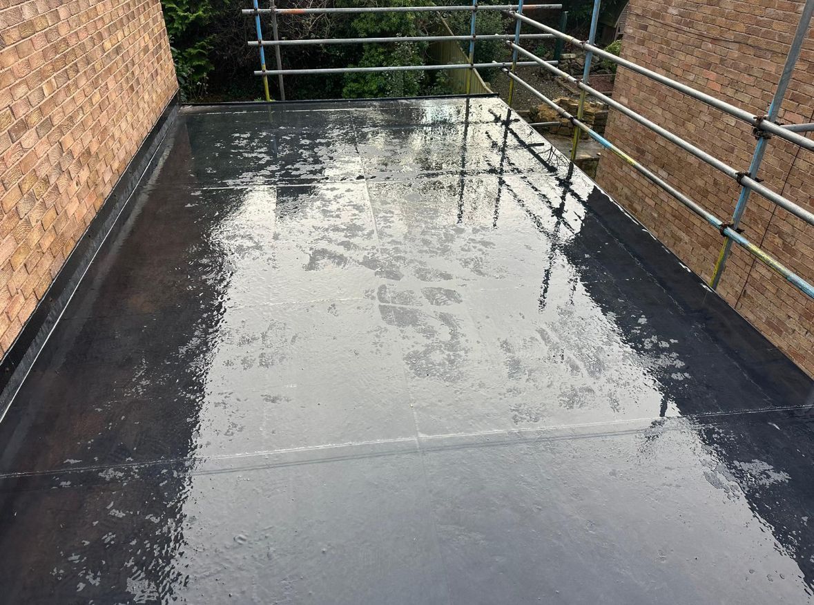 Top-down photo of a freshly laid EPDM rubber roof by A. Armstrong Roofing