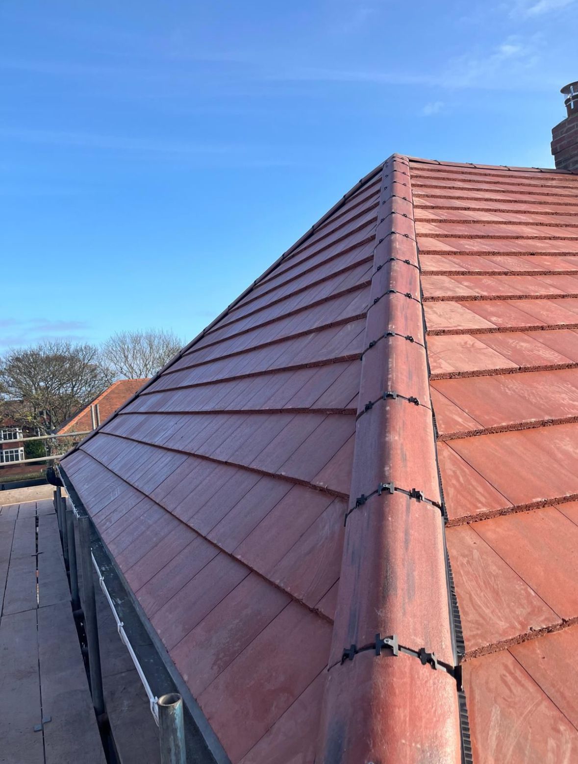 Close shot of some newly installed ridge tiles on a roof in the North-East