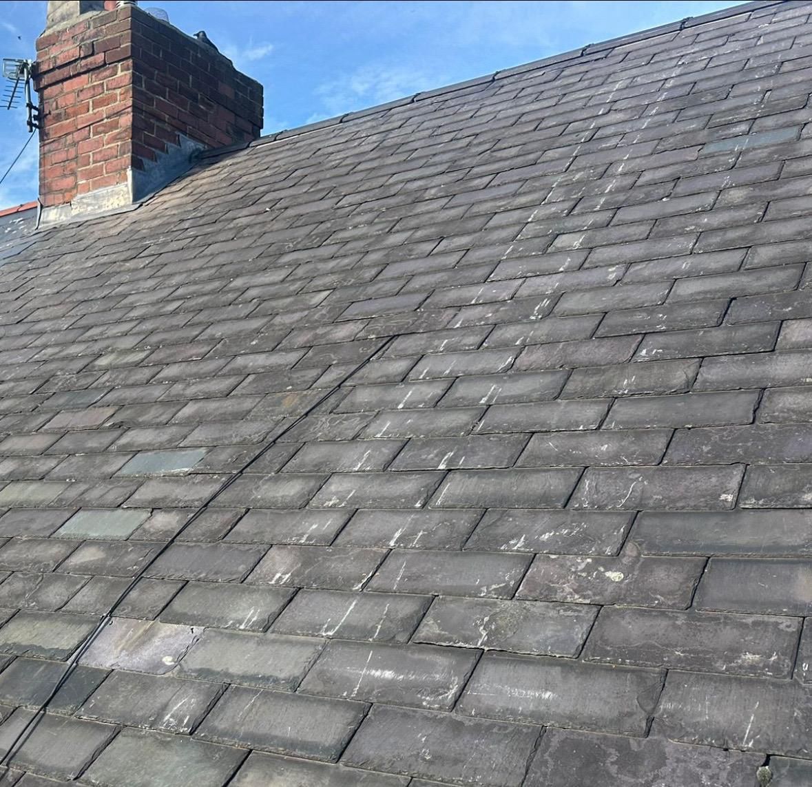 Slate tile repair on a roof in Washington