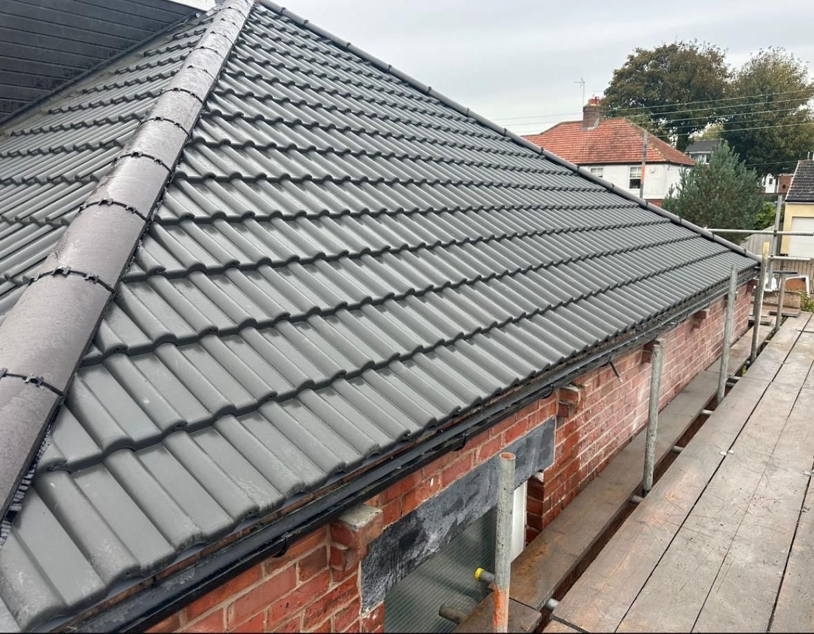 A new grey tiled roof installed by A. Armstrong Roofing.