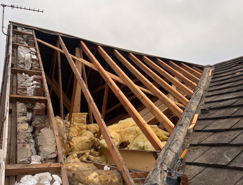 Opened roof mid-replacement, with framework on show