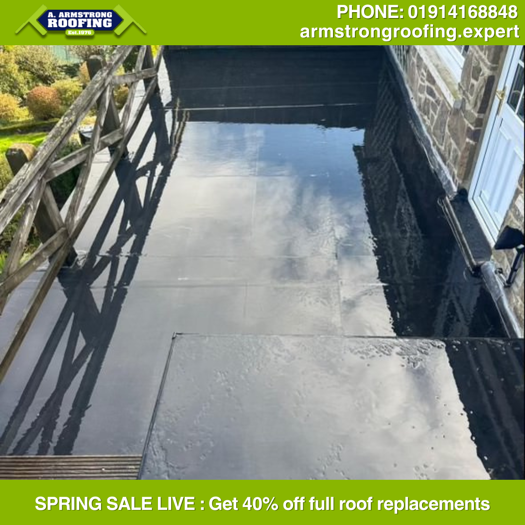 Modern flat roof replacement on a residential building in Durham, featuring a smooth and durable finish.