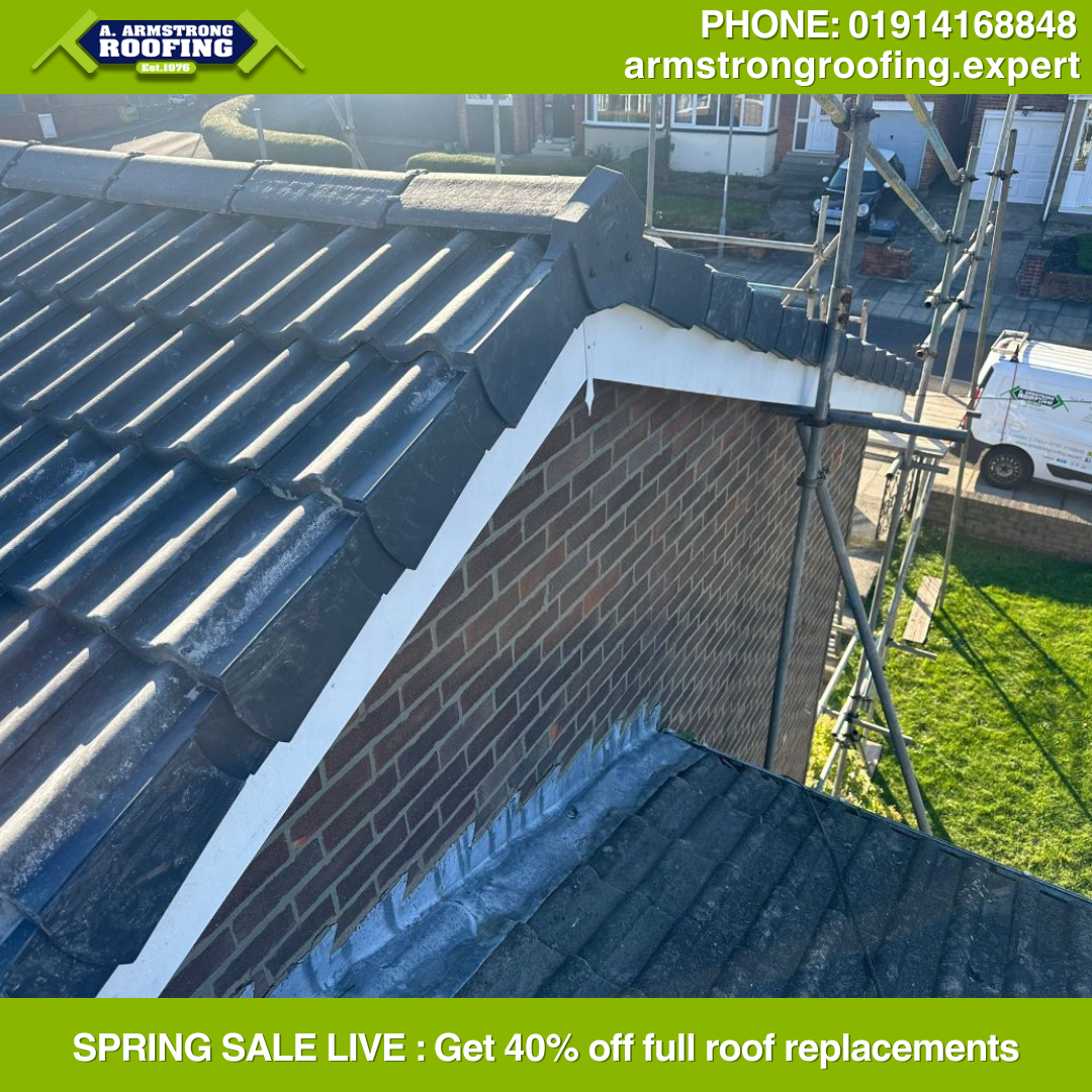 Detailed view of tiled pitched roof installation with lead flashing work on a residential property in Gateshead.