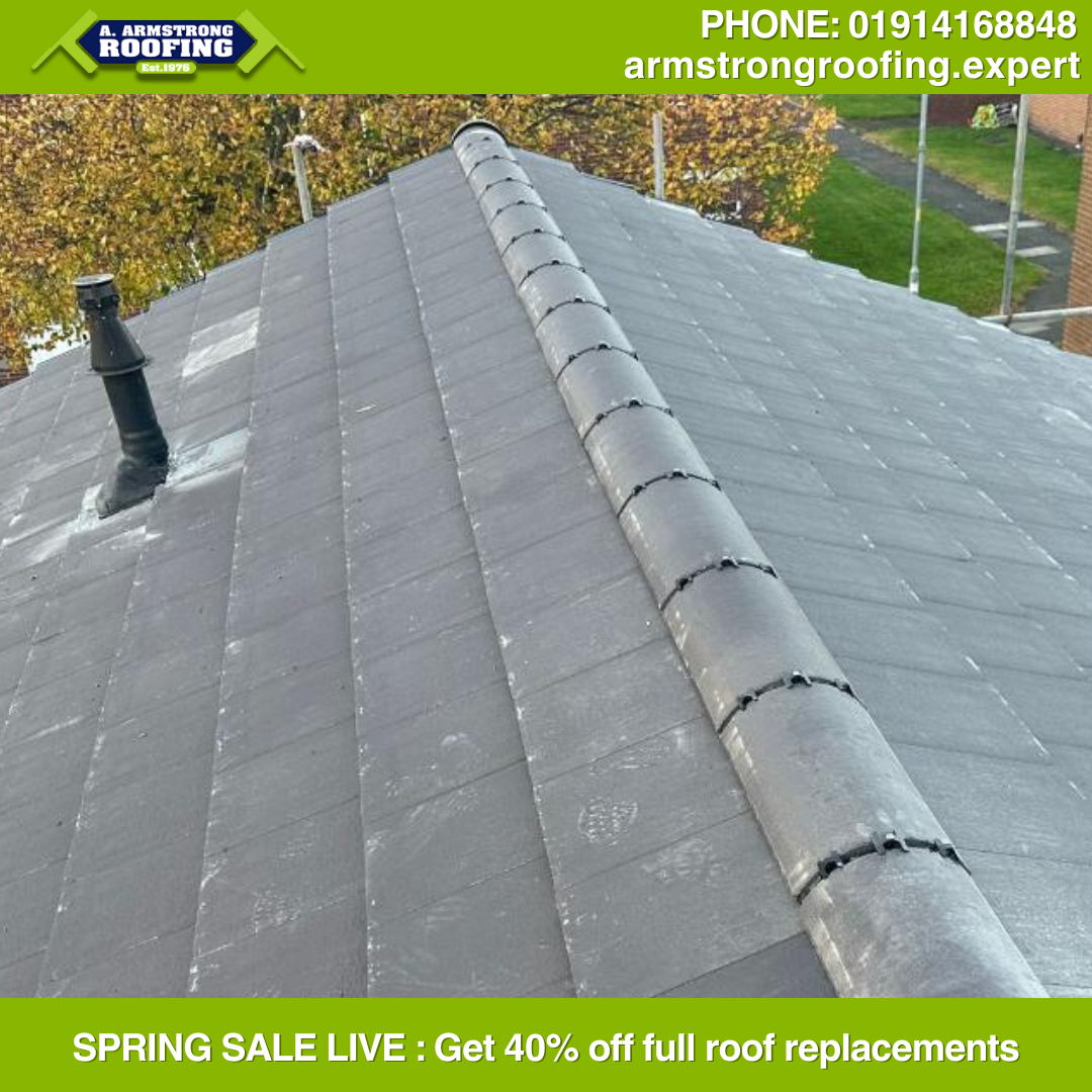 Close-up of a completed slate ridge roof with secure ridge tiles and clean finish in Gateshead.