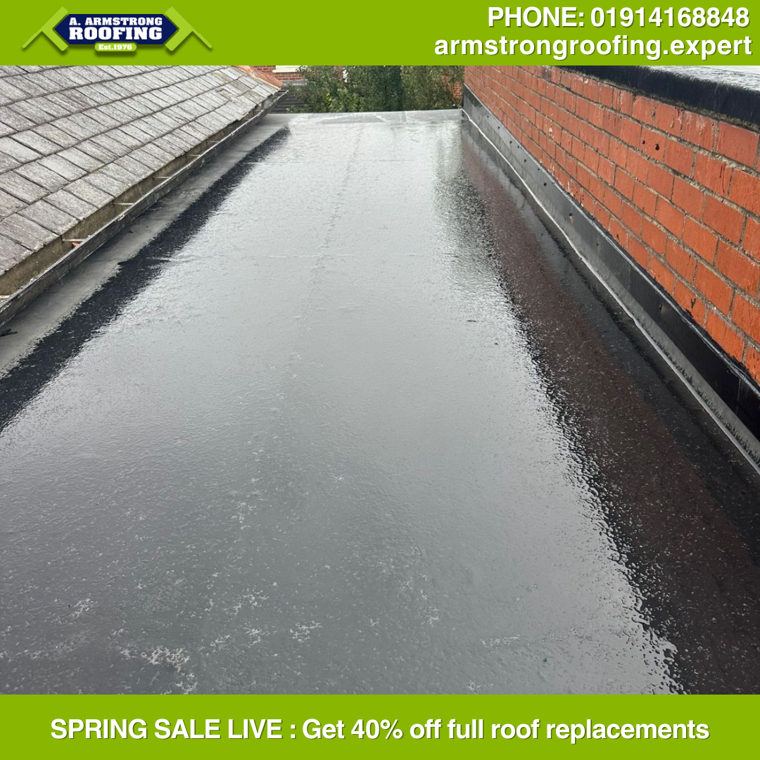 Newly installed flat roofing system with modern waterproofing, part of Armstrong Roofing’s 40% off spring sale offer.