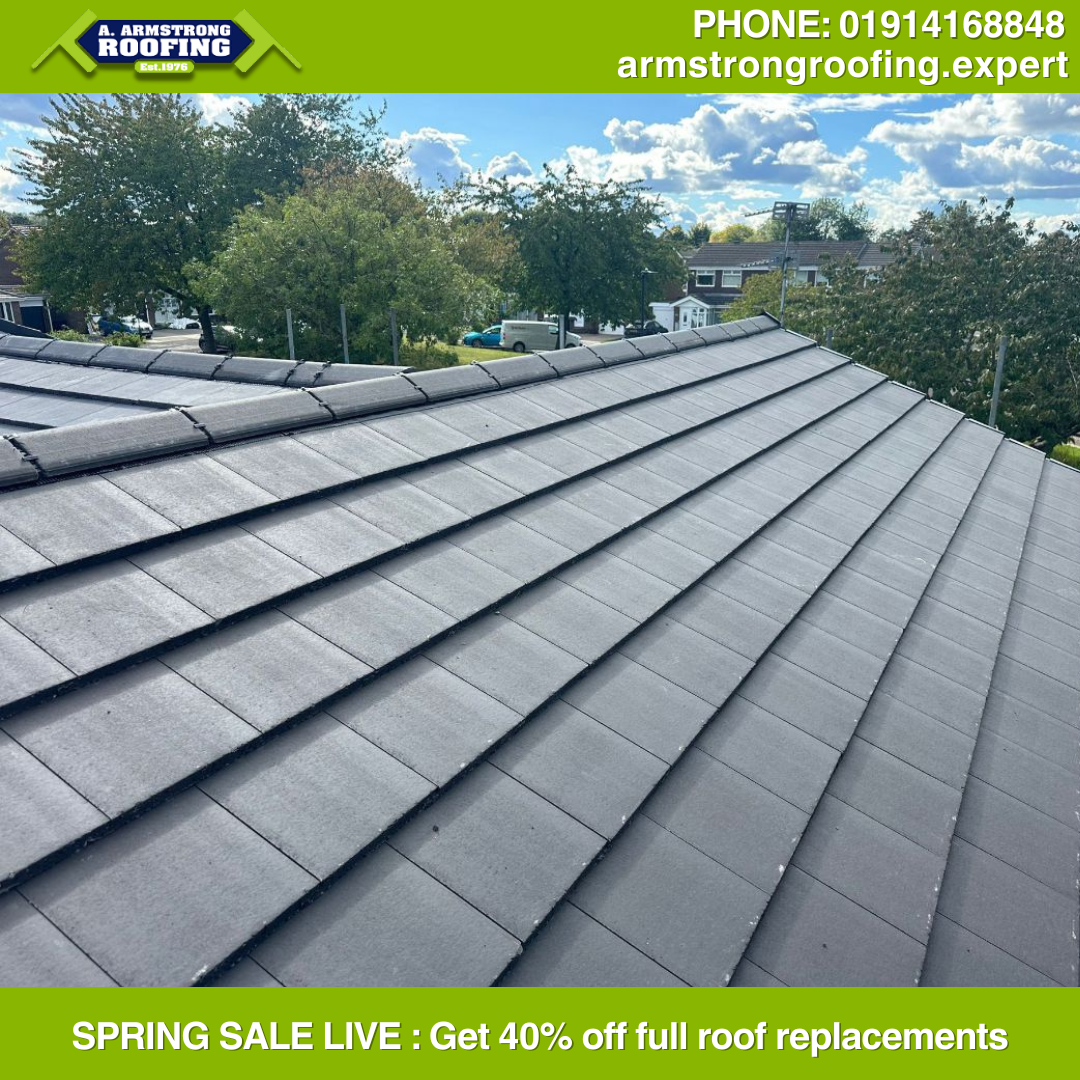 Completed pitched roof replacement with clean, grey slates – installed by Armstrong Roofing as part of their spring discount campaign.