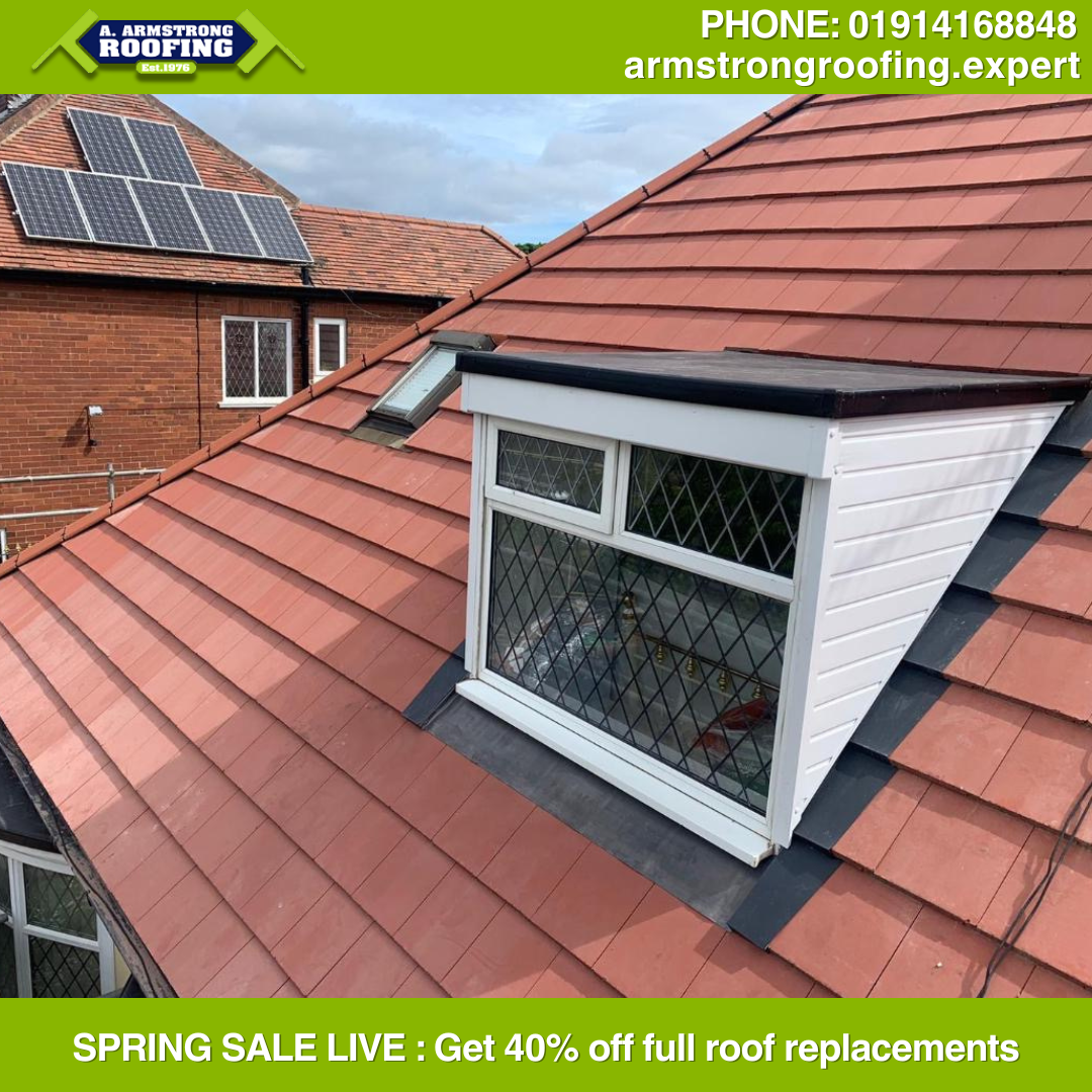 Red tiled pitched roof with a newly sealed dormer window, highlighting Armstrong Roofing’s attention to detail during spring sale projects.