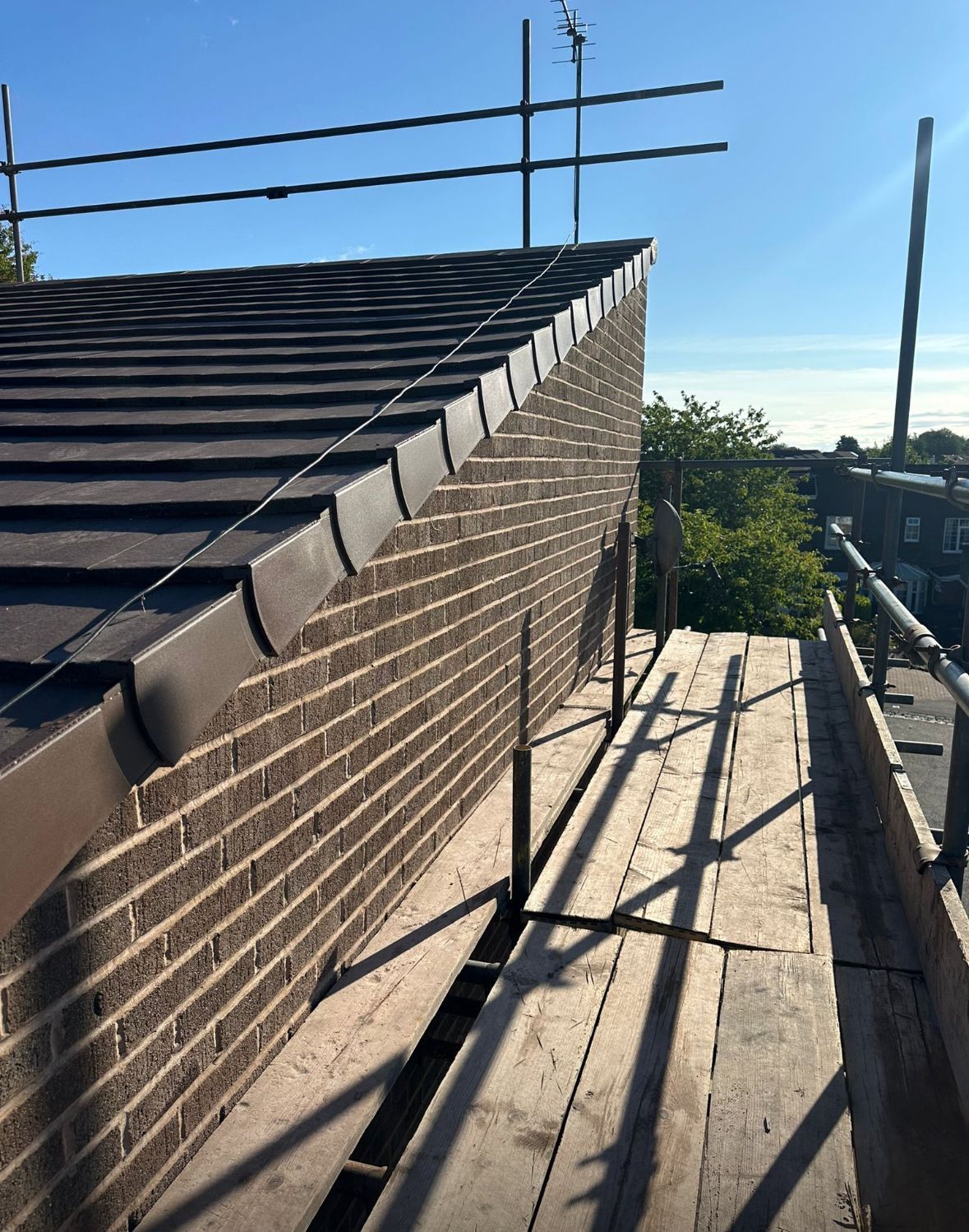 Gable-end of a roof, recently repaired by A. Armstrong Roofing