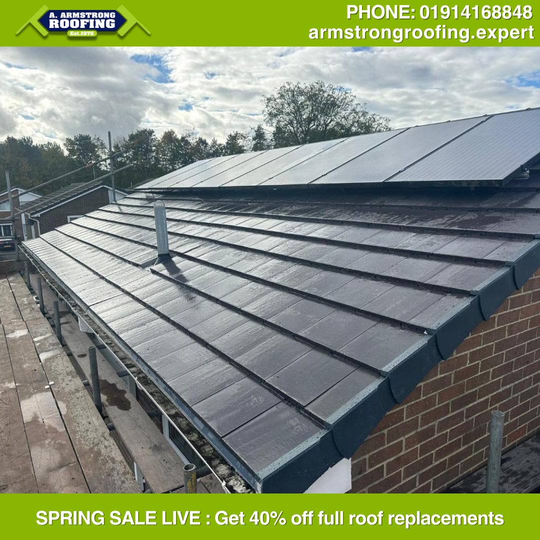 Angled perspective of a full roof replacement with uniform grey tiles and accurate flashing, highlighting professional finish and durability.