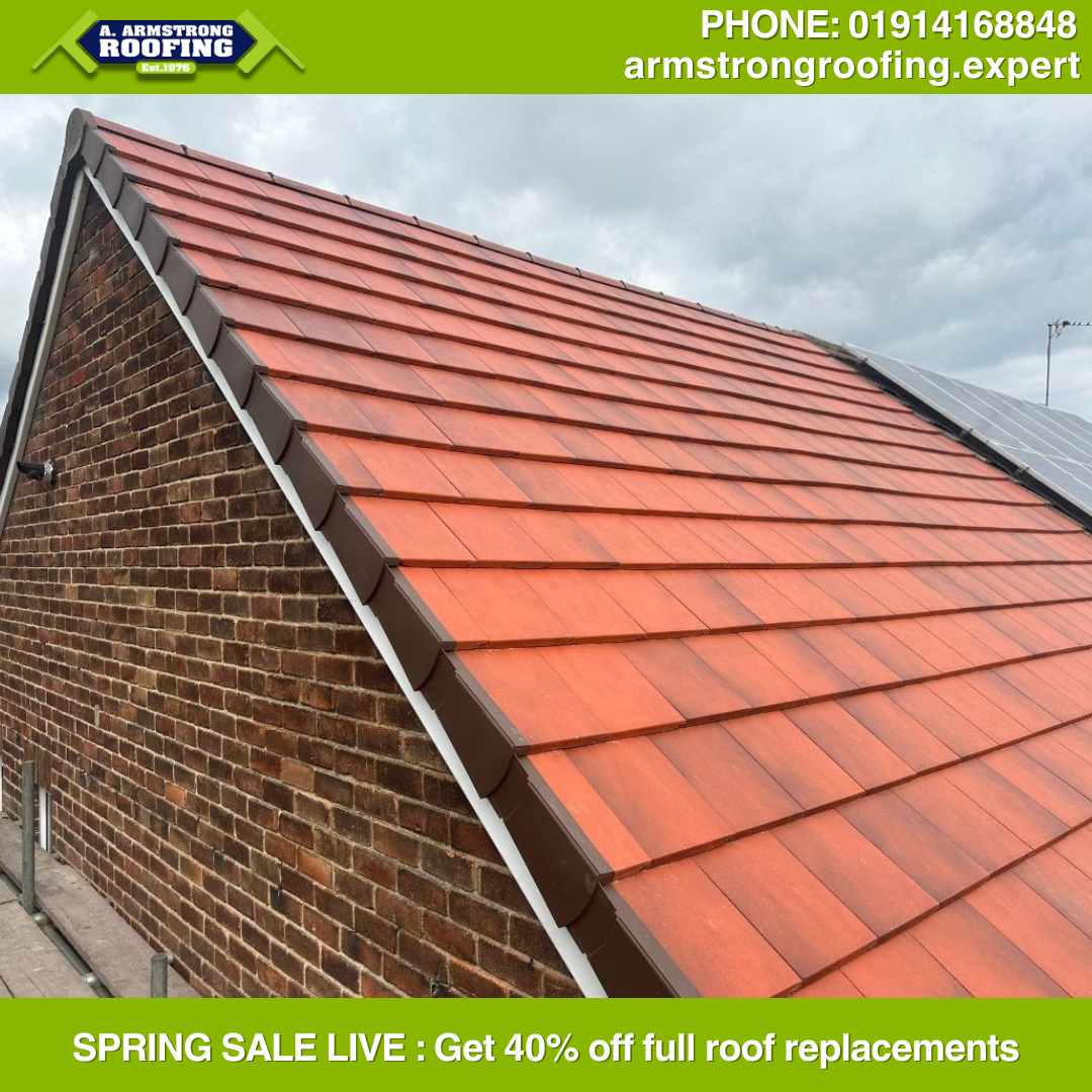 Bright red tiled pitched roof on a brick home, neatly finished with ridge tiles and side flashing—demonstrating Armstrong Roofing’s craftsmanship and vibrant material choice.