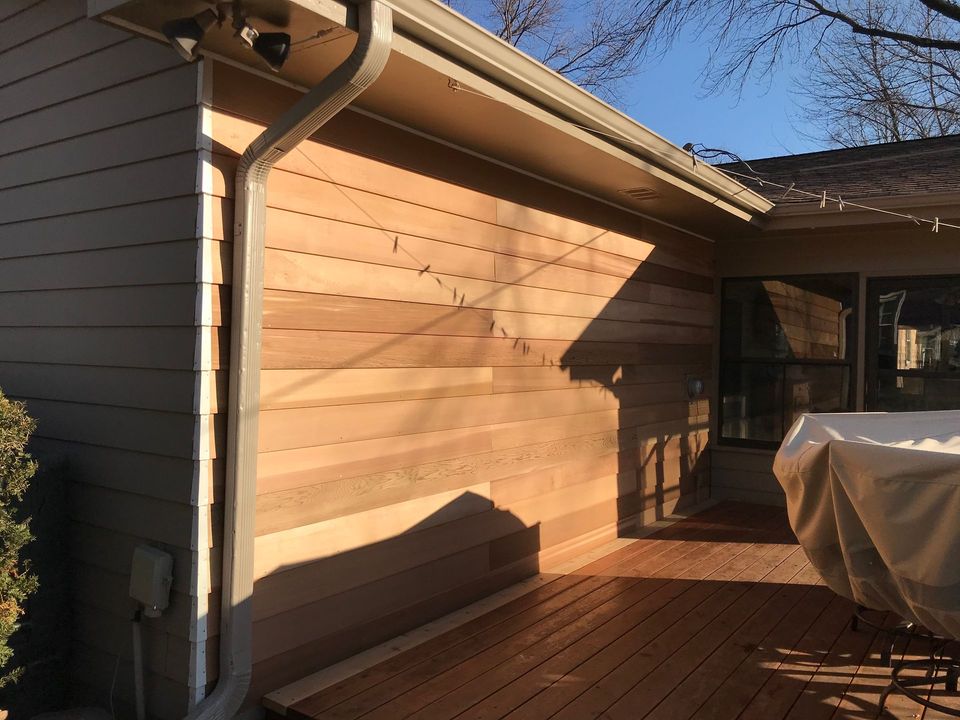 A ladder is sitting in front of a house under construction.