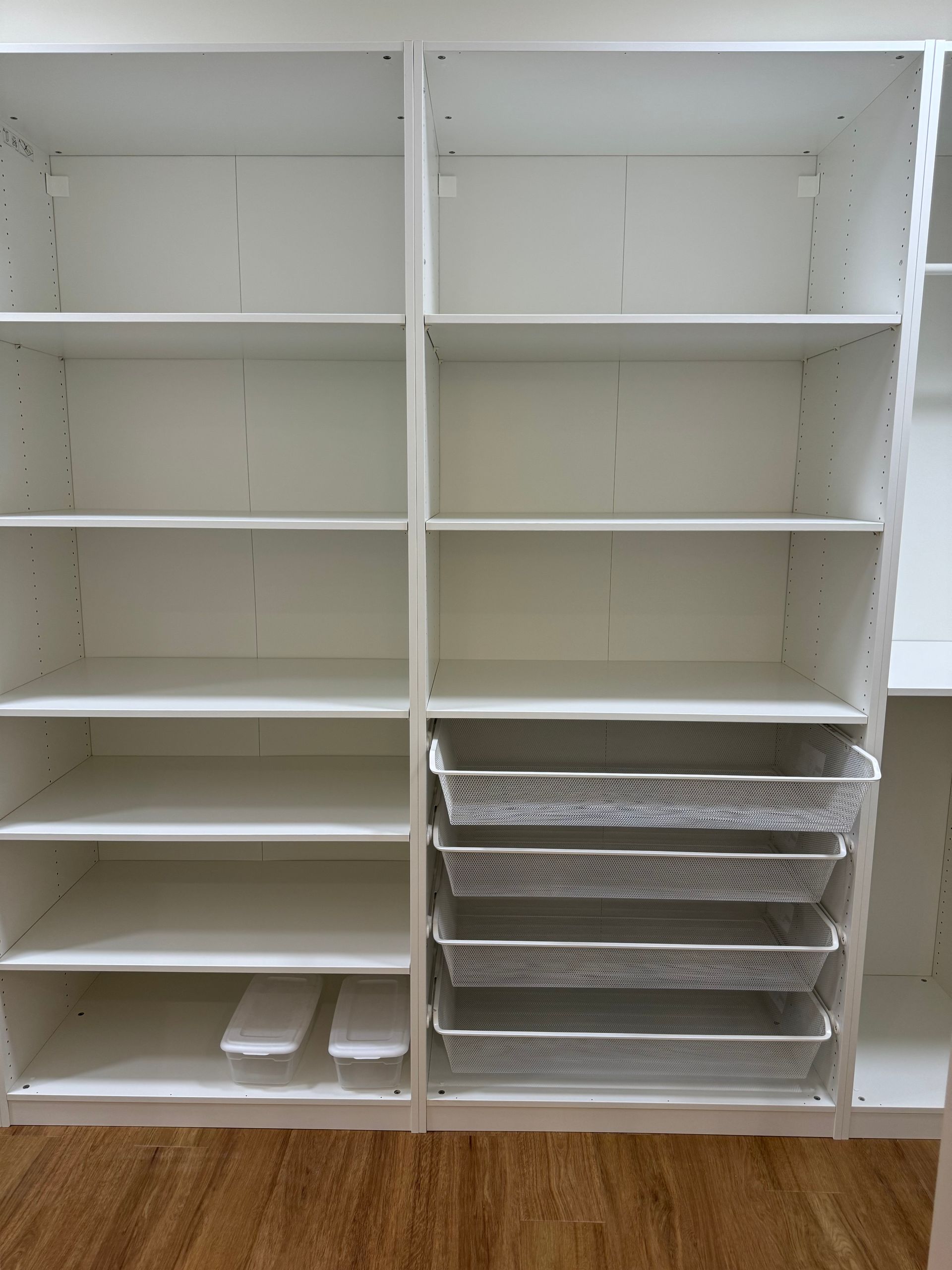 A closet with lots of shelves and baskets.