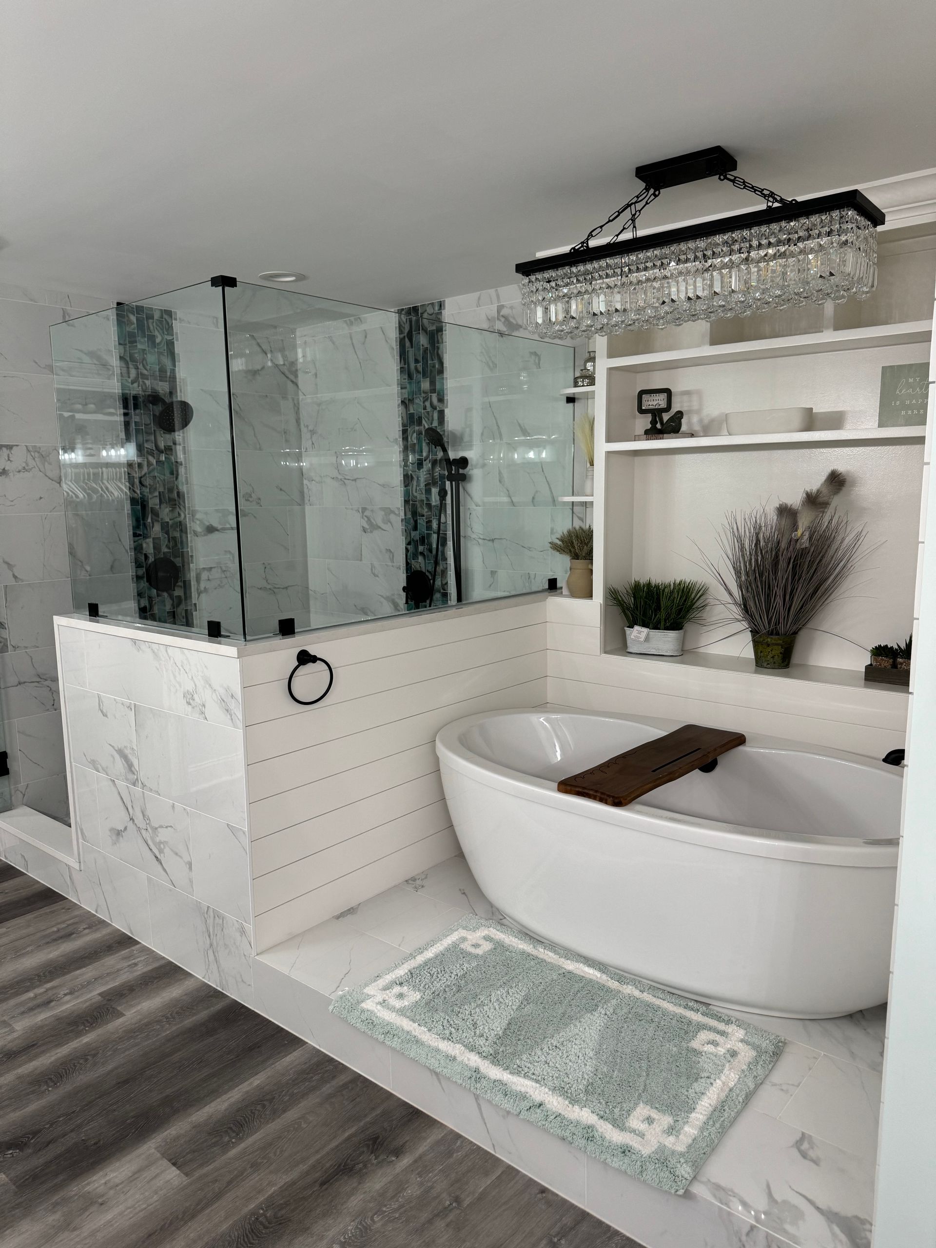 A bathroom with a bathtub and a shower.