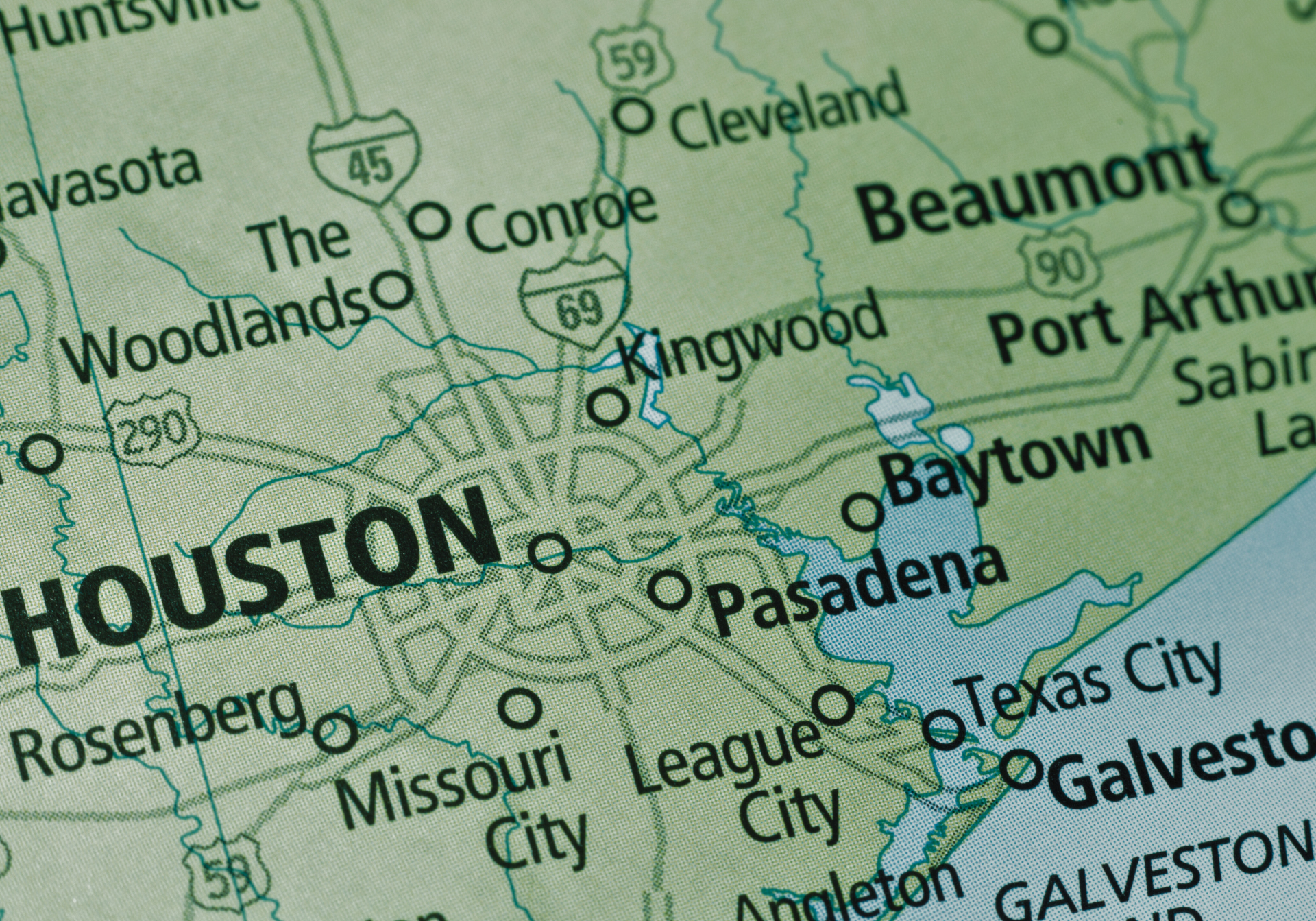 Map of Houston, Texas, with surrounding cities and highways, including Galveston and Beaumont.