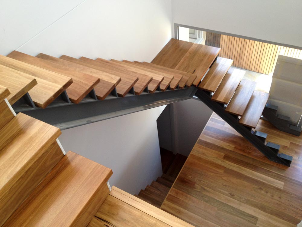 modern wood staircase without handrails