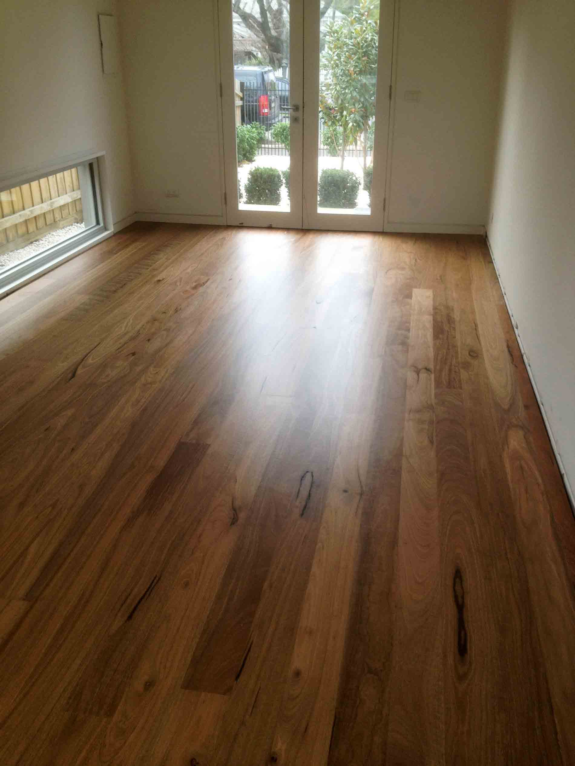 wood floor with a glass door leading to the back yard