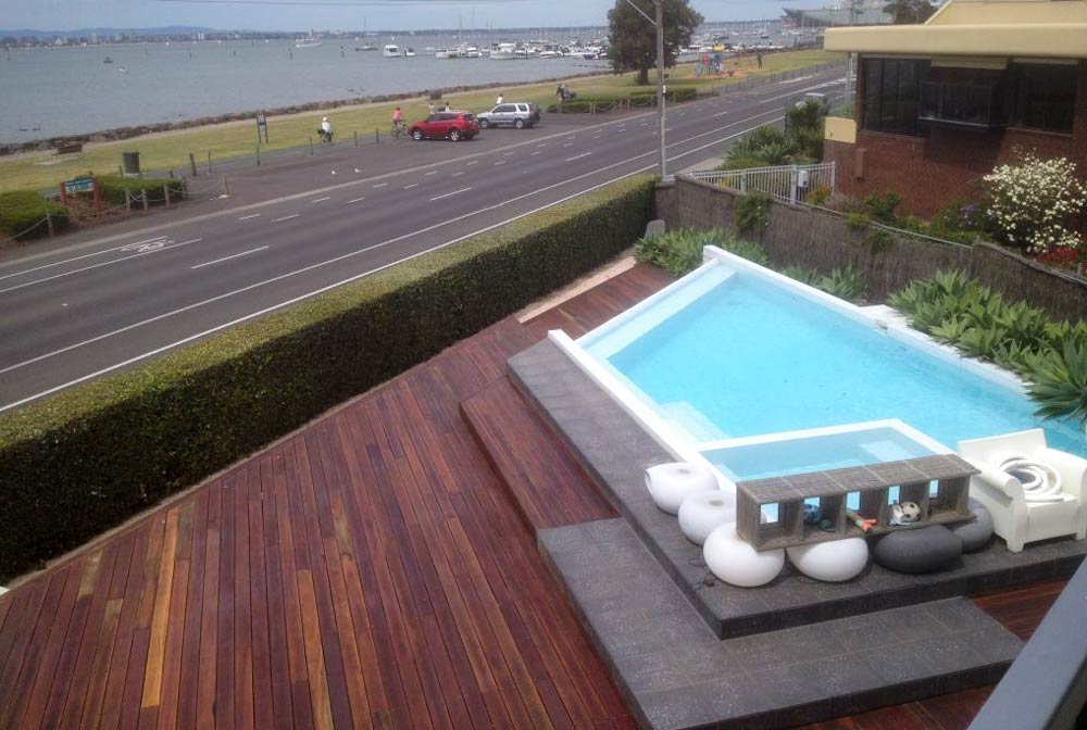 wood deck with a pool on it